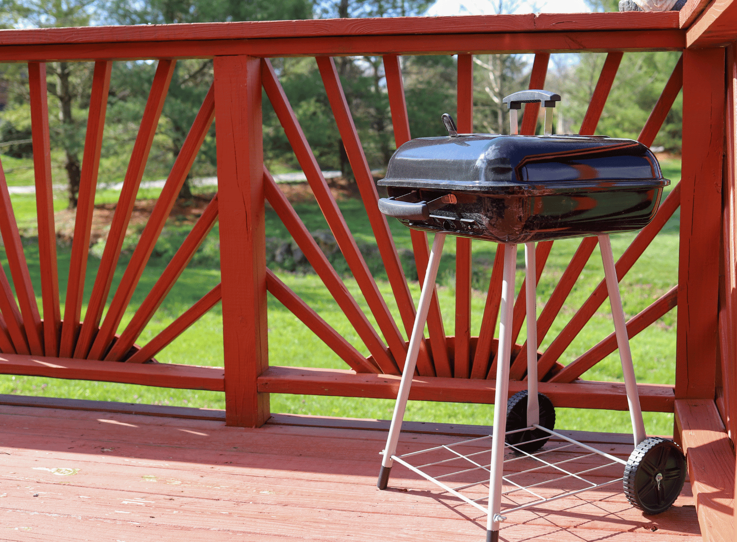 small charcoal grill on a patio