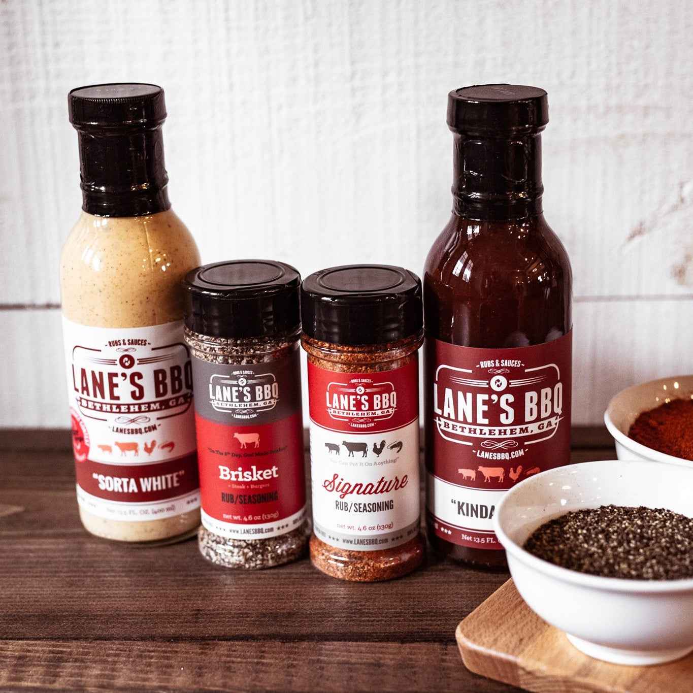 Lane's BBQ collection of Sorta White Sauce, Brisket Rub, Signature Rub, and Kinda Sauce