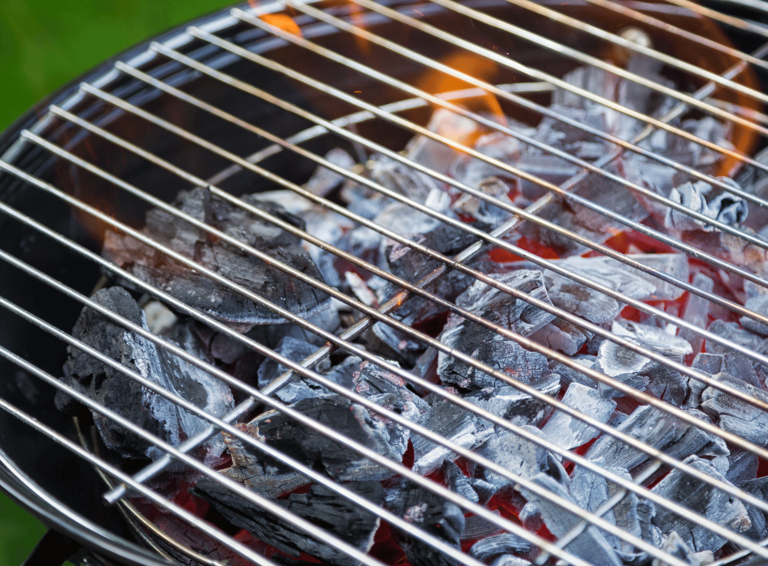 Close up of charcoal grill with stainless steel grate