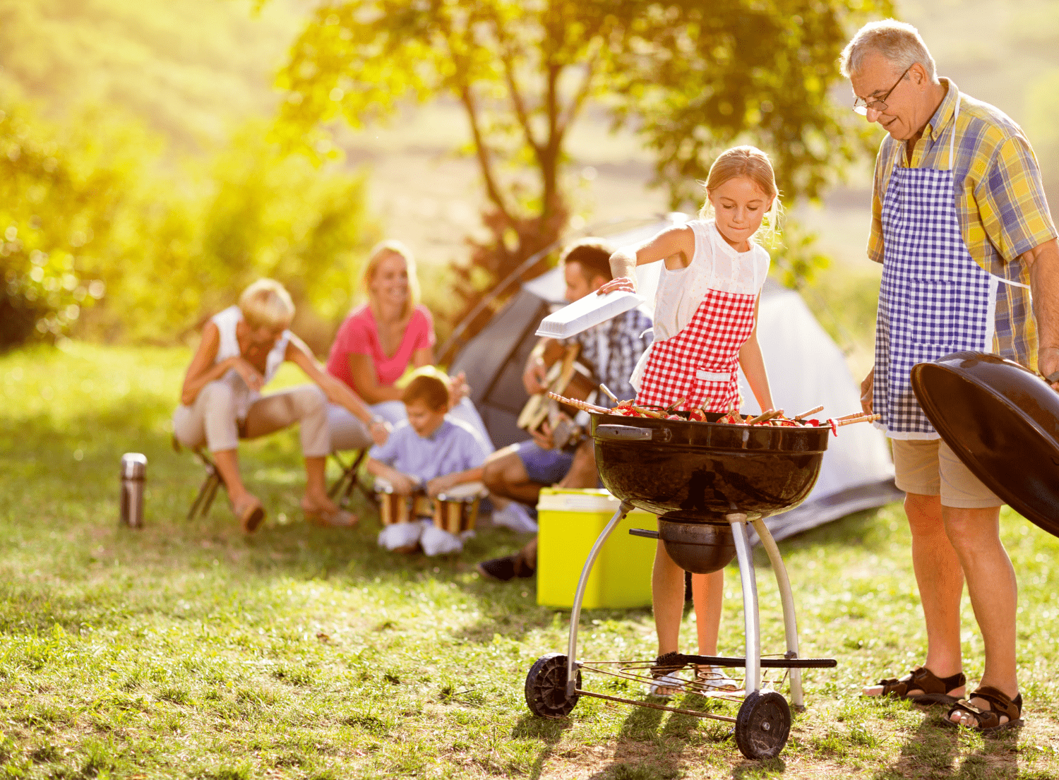 Family around charcoal bbq grilling - how to arrange charcoal grill