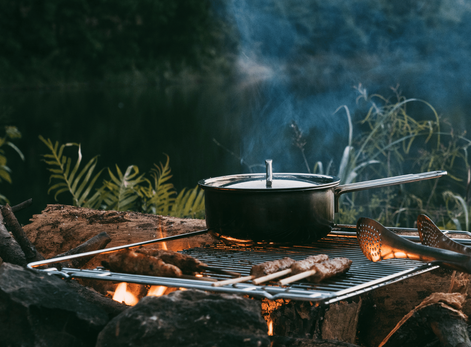 pot and meat grilling on a outdoor grill
