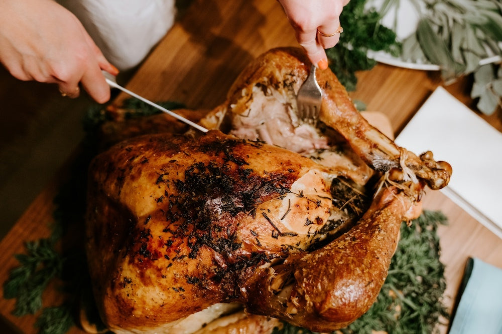 Grilled turkey leg on wooden tray